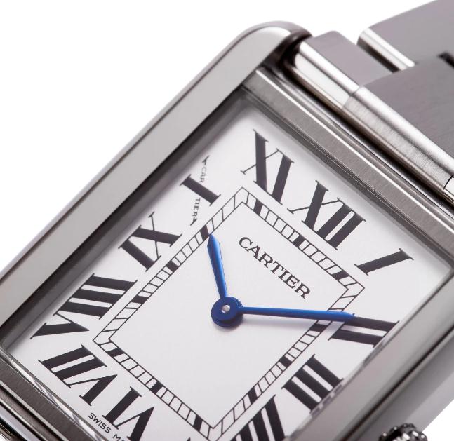 The elegant watches fake Cartier Tank Solo W5200013 have silver-plated dials, black Roman numerals and blue hands.