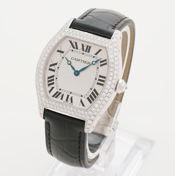 The 18k white gold copy Cartier Tortue WA503851 watches have black alligator leather straps.